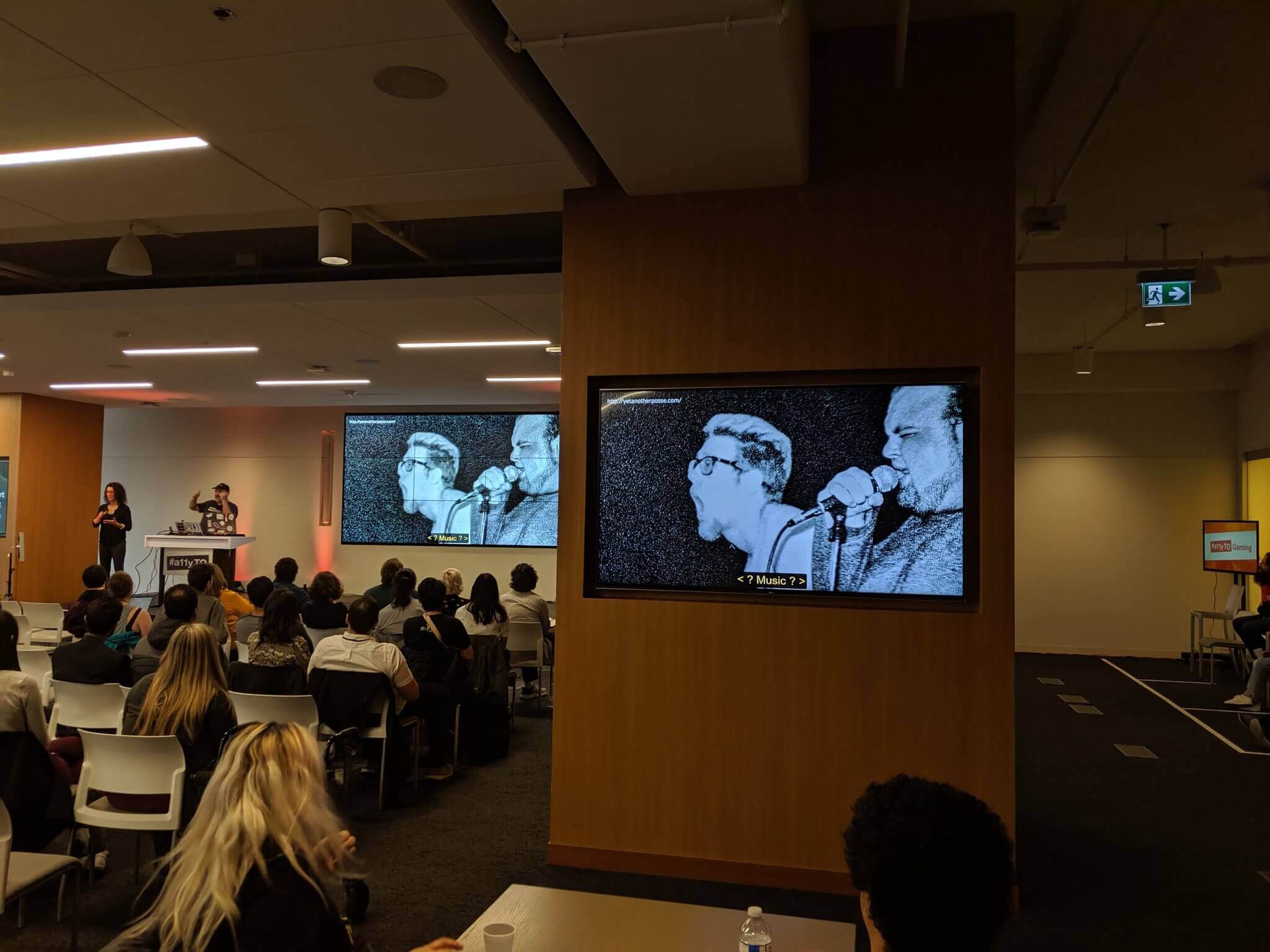 A slide with a concert photo of a skinny white kid and another guy both screaming into microphones.
